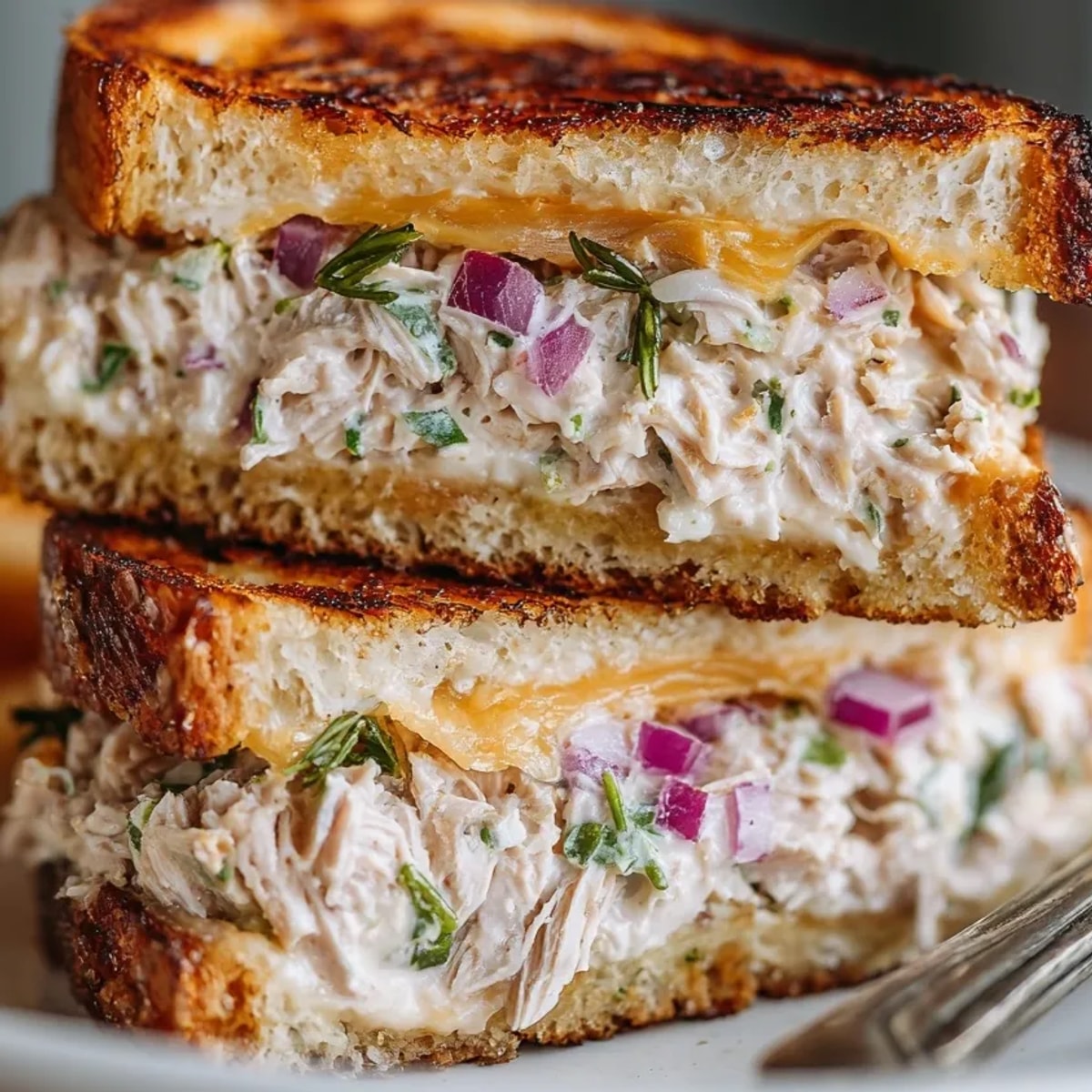 Buttery Tuna Melt Grilled Cheese sandwich, freshly grilled and ready to be served.