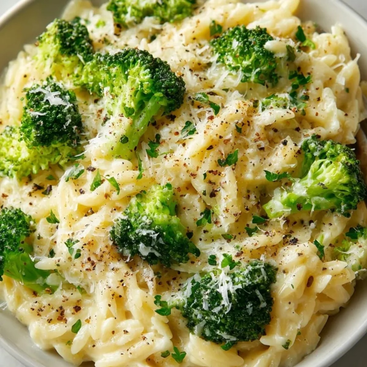 Creamy Broccoli Cheddar Orzo recipe: golden pasta, bright green broccoli, and melty cheddar.