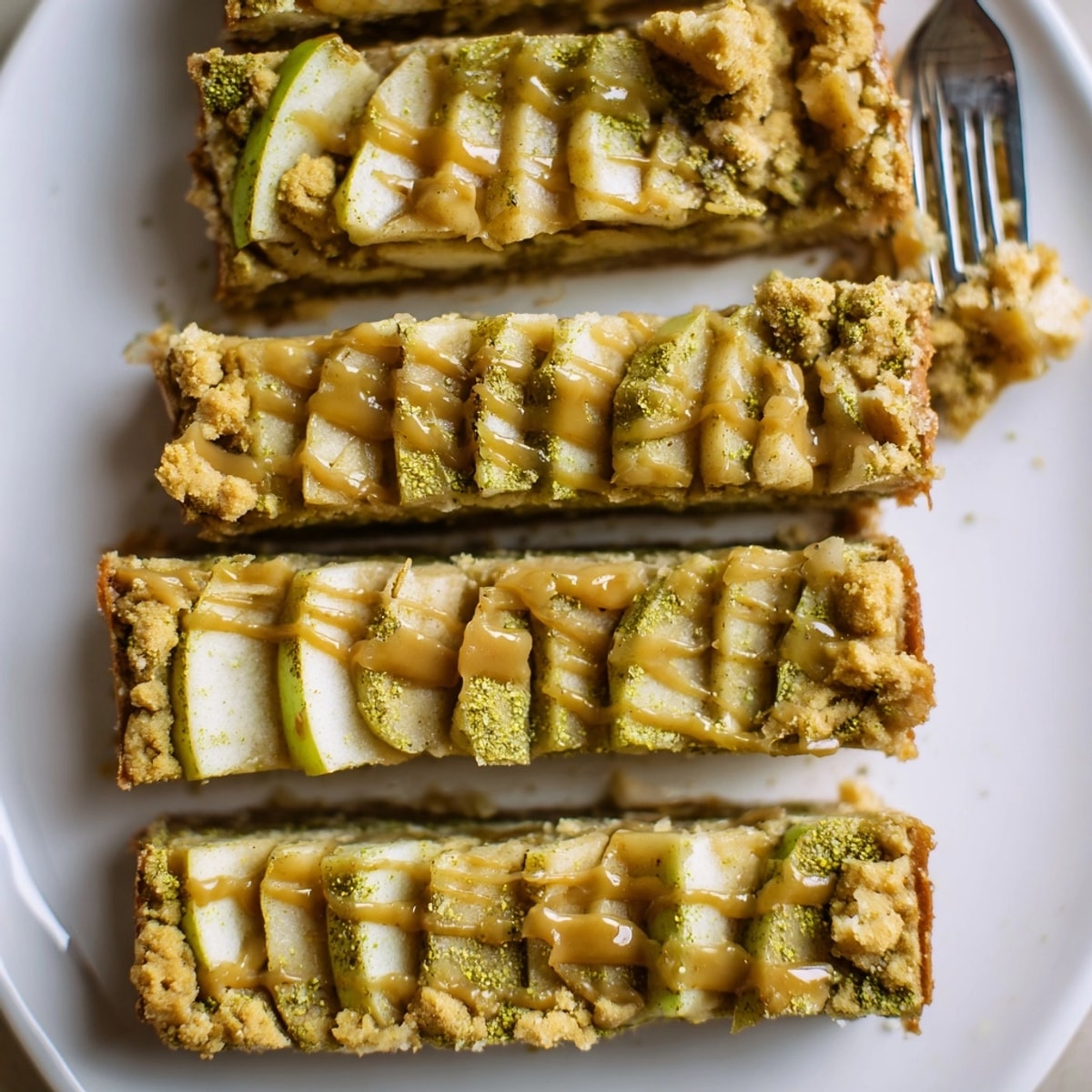 Golden, crumbly Matcha Caramel Apple Bars, oozing with warm caramel, ready to serve.