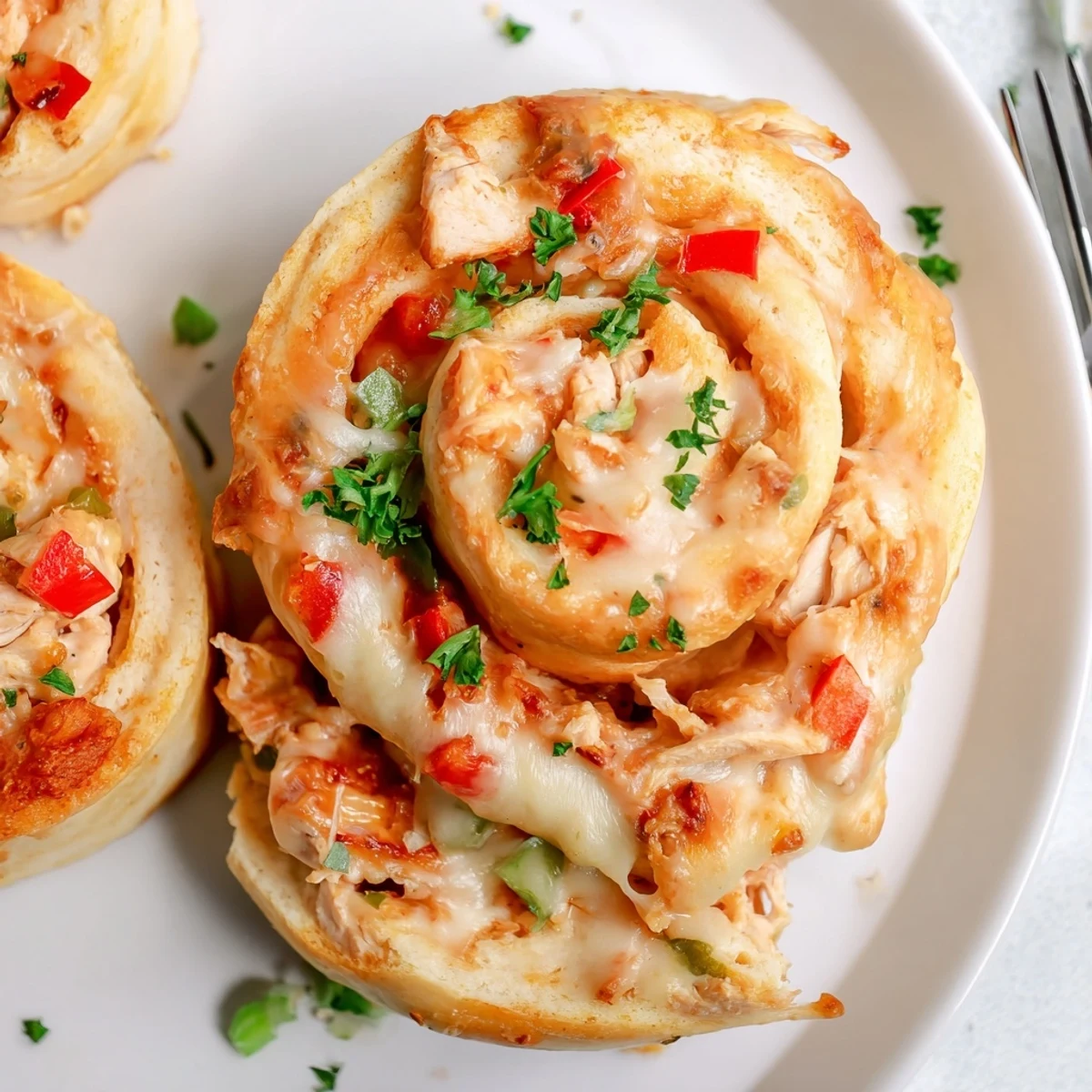 Cajun Chicken Alfredo Pizza Rolls bursting with spicy flavor and creamy cheese goodness.
