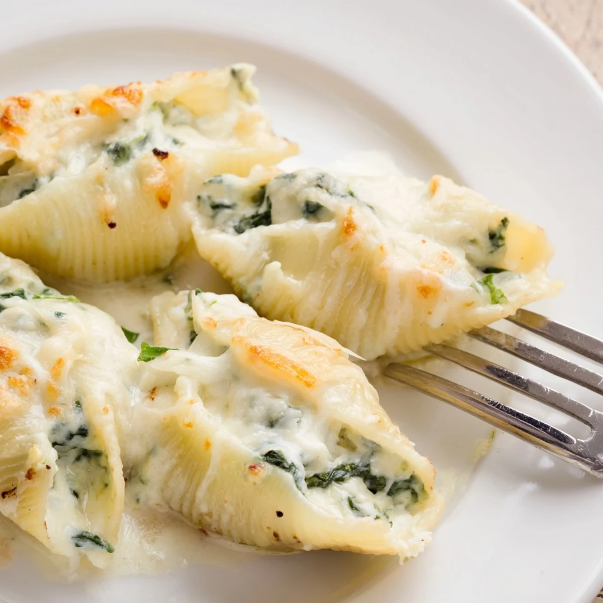 Irresistible Alfredo Spinach Ricotta Stuffed Shells, perfect for a cozy family dinner.