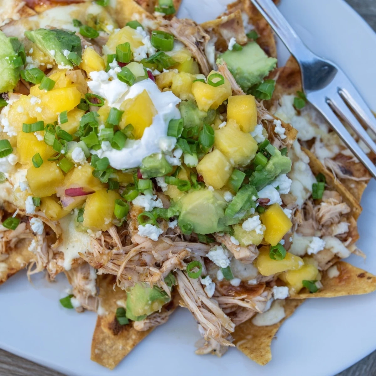 Savory Mango Pineapple Chicken Nachos ideal for sharing at parties or gatherings.