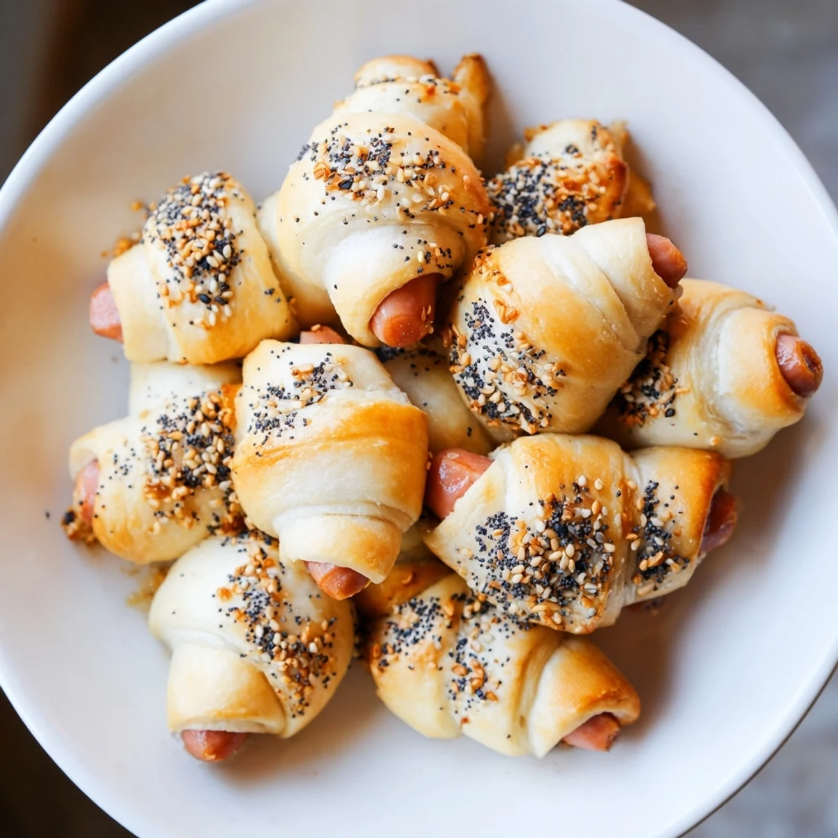 Golden-brown Everything Bagel Pigs in a Blanket fresh from the oven, perfect for sharing.
