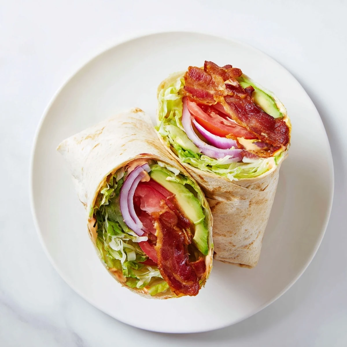 Crispy bacon and fresh veggies fill the soft tortilla in these Zesty BLT Wraps with flavor.