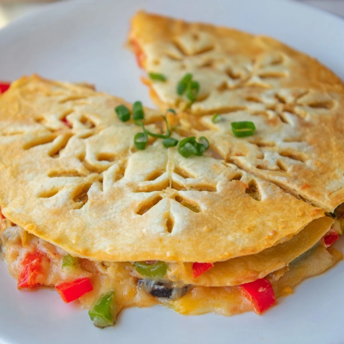 Crispy-edged Express Snowflake Quesadillas with bubbling cheese inside, perfect with cool sour cream and salsa.