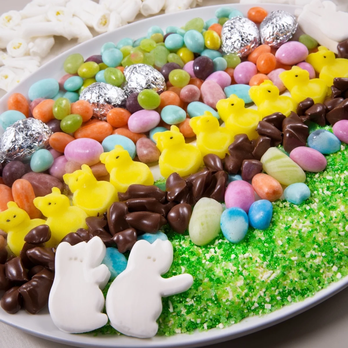 Imagine this festive Egg-Shaped Candy Platter bursting with a joyful assortment of Easter candies, ready to eat.
