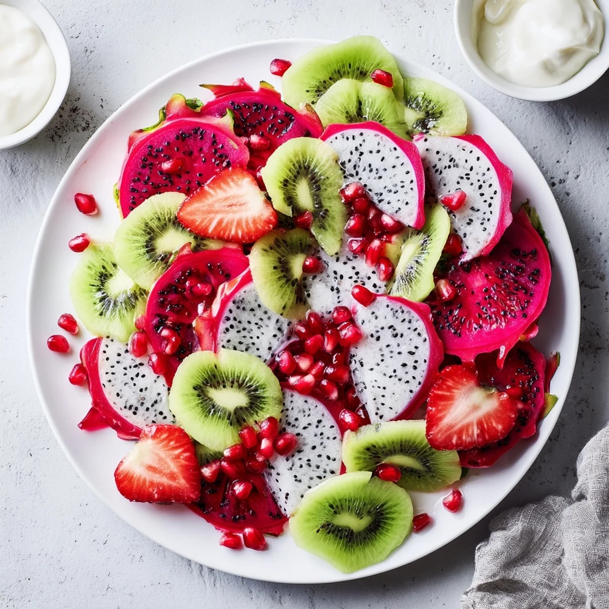 Beautiful dragon scales fruit board with overlapping fruit slices, featuring chocolate and yogurt dips for dipping.