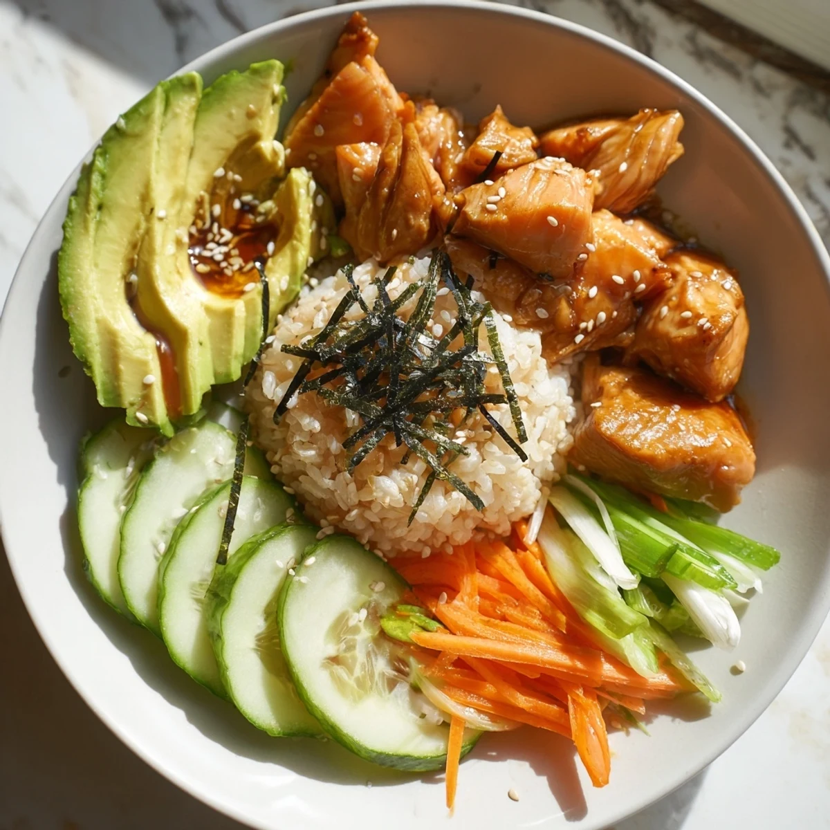 Steaming Japanese-Style Salmon & Chicken Rice Bowl, featuring tender salmon alongside seasoned chicken and fresh vegetables.