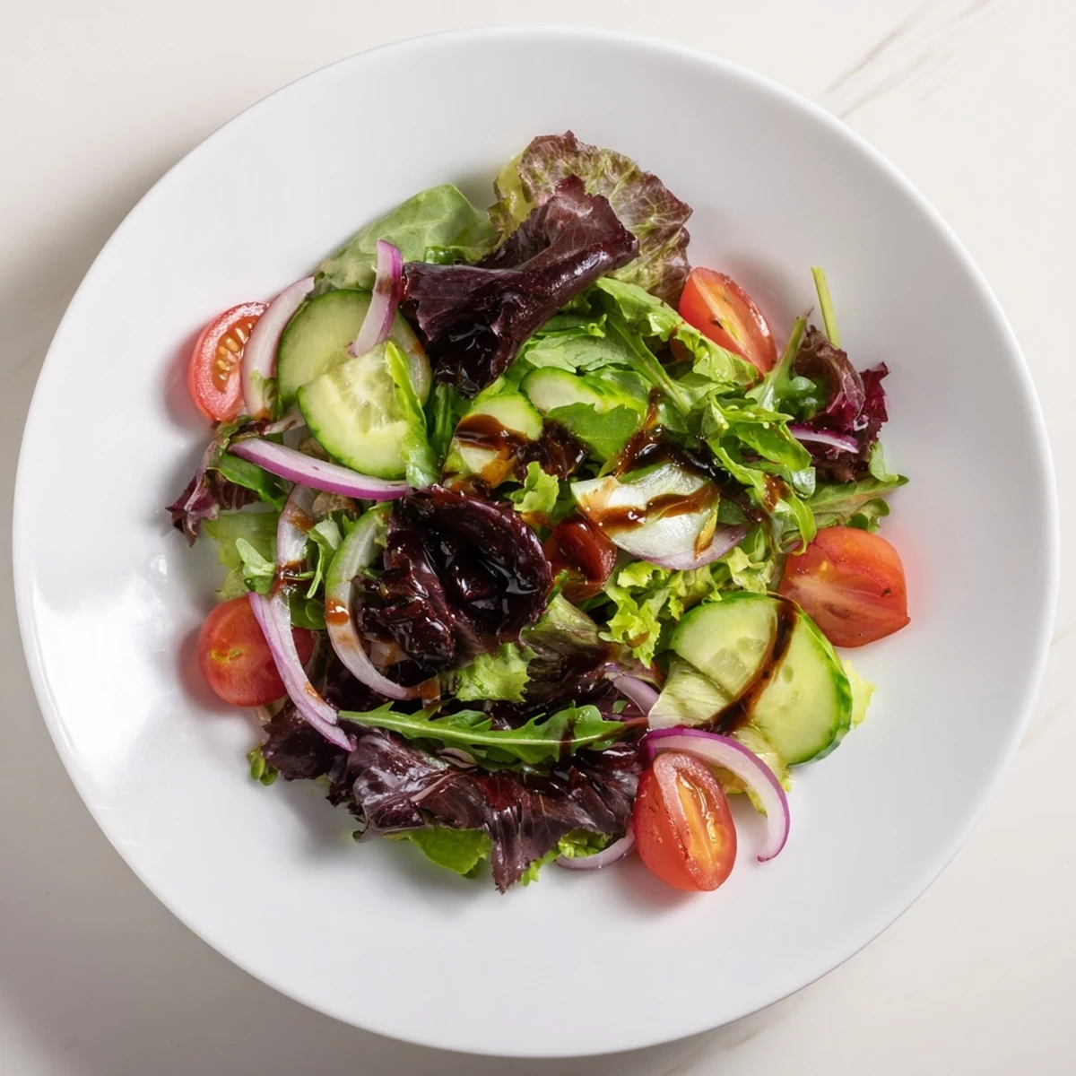 Vibrant Quick Balsamic Vinegar Salad, showcasing a medley of fresh greens with a glossy, tangy dressing.