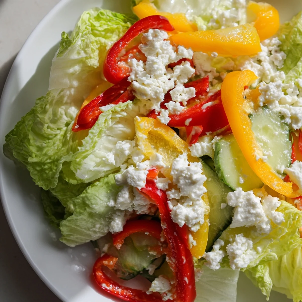 Close-up of a refreshing Bella Hadid Salad, showcasing vibrant peppers and a zesty lemon dressing.