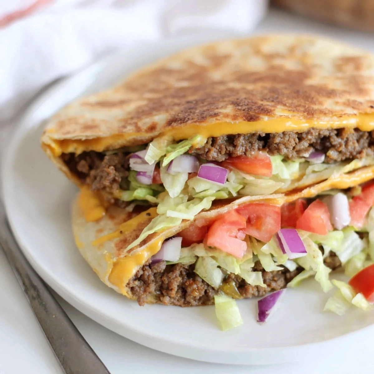 A close-up of a perfectly grilled Taco Bell Crunchwrap Supreme, ready to be sliced and enjoyed.