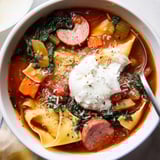 Deconstructed lasagna, Lasagne Soup simmers, aromatic with herbs, ready to ladle.