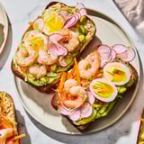 Close-up of Japanese Bento Open-Face Sandwiches; creamy avocado and sliced egg shine.