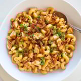 Savory One-Pot Honey BBQ Chicken Mac and Cheese garnished with fresh parsley and cheese.  