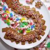 Delightful close-up of a Candy Land gingerbread path dessert board, perfect for sharing.