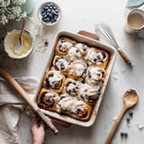 A pan of blueberry swirl rolls.