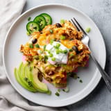 A plate of food with a fork and knife.