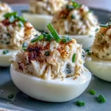 Luscious Crab Cake Deviled Eggs: A seafood twist on classic deviled eggs, topped with lump crab, lemon, and a sprinkle of Old Bay seasoning.