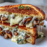 A hearty Mushroom Swiss Grilled Cheese, perfectly toasted with rich sautéed mushrooms and nutty Swiss.