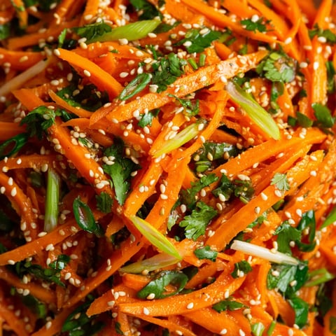 A close up of a dish of carrots.
