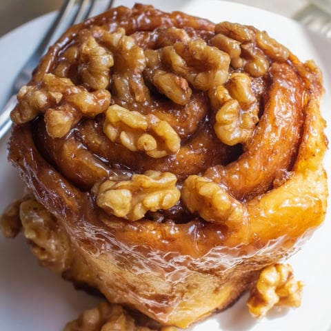 Golden Cinnamon Maple Walnut Sticky Buns, warm and gooey, fresh from the oven.