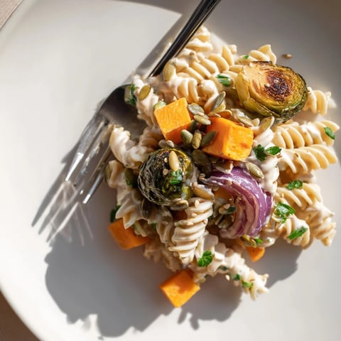 Close-up of vibrant Miso Pasta Salad, showcasing tender roasted fall vegetables and creamy dressing.