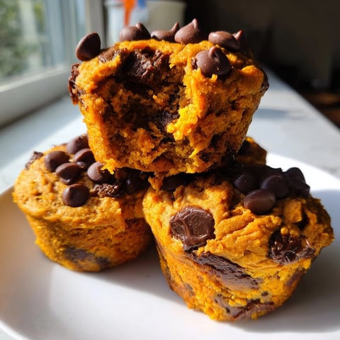 Close-up of Sweet Potato Pumpkin Chocolate Chip Muffins; warm aroma, tender crumb.