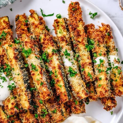 Crispy Cajun zucchini sticks golden-brown, perfect for dipping in ranch sauce. 