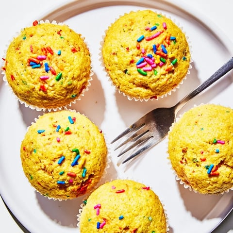 Colorful Funfetti cornbread muffins fresh out of the oven, perfect for celebrations.  