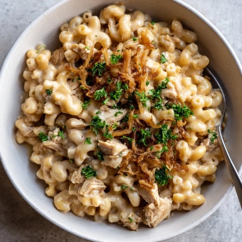 Creamy One-Pot Honey BBQ Chicken Mac and Cheese topped with crispy fried onions.  