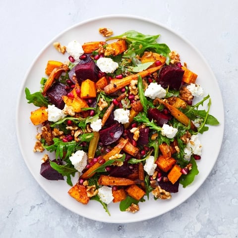 Seasonal Root Vegetable & Goat Cheese Salad, vibrant colors with roasted veggies on greens.