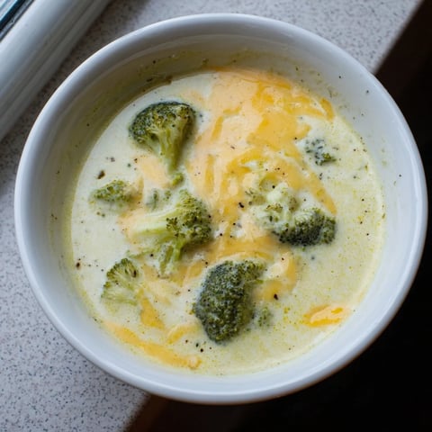 Creamy Broccoli Cheese Soup, a vibrant bowl, showing perfectly blended cheddar and tender broccoli.