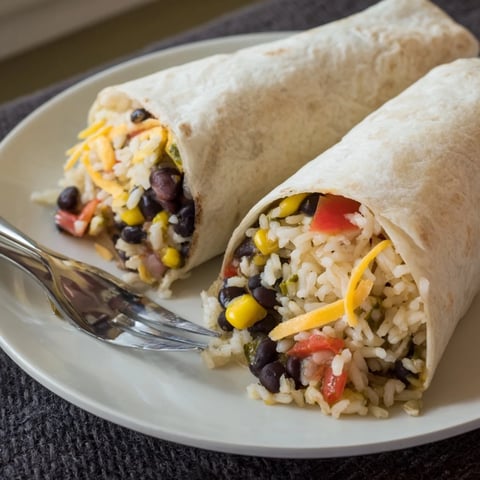 Steaming, freshly-made freezer-friendly burritos, a delicious vegetarian meal ready for a quick bite.