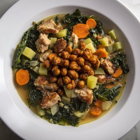 Savory Chicken Kale Soup with crispy chickpeas, a comforting bowl filled with hearty ingredients.