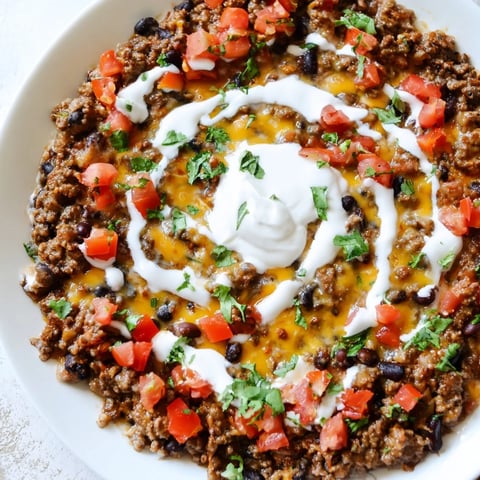 Warm slow cooker cream cheese taco dip, a creamy, savory snack perfect for sharing.
