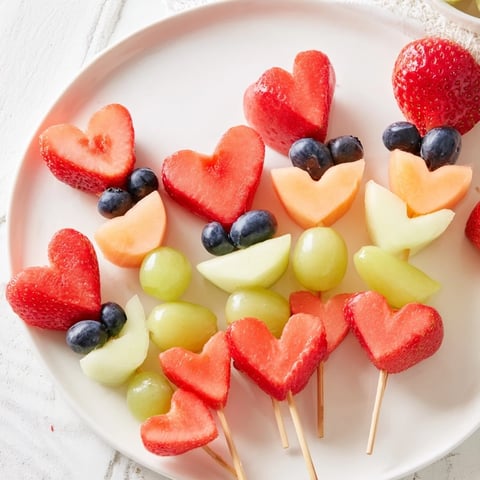 Berry Good Heart Fruit Skewers bursting with fresh, colorful fruit, perfect for a healthy and fun snack.