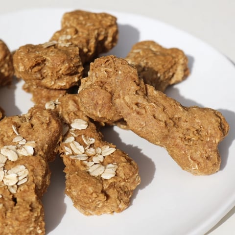Golden-brown Pawsitively Good Dog Bone Treats, fresh from the oven, ready to become a tasty reward.