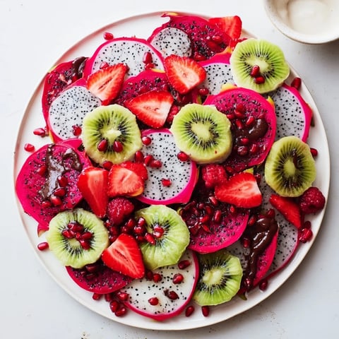 Vibrant Dragon Scales Fruit and Dip Board with colorful fruits and creamy yogurt dips, perfect for any party!