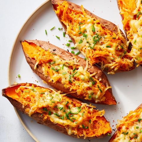 Steaming-hot Sweet Potato & Cheese Whole Roast, oozing with creamy, melted cheddar and ready to eat.