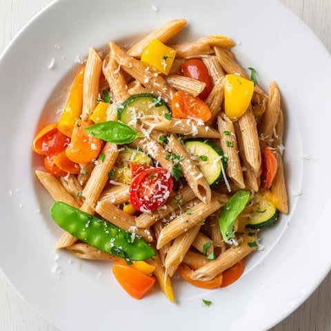 One-Pot Creamy Pasta Primavera bubbling, with colorful vegetables and perfectly cooked pasta, ready to serve.