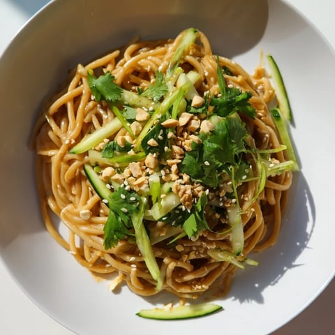 Chilled Spicy Sesame Noodle Salad, tossed with vibrant veggies, ready for a satisfying, refreshing lunch.
