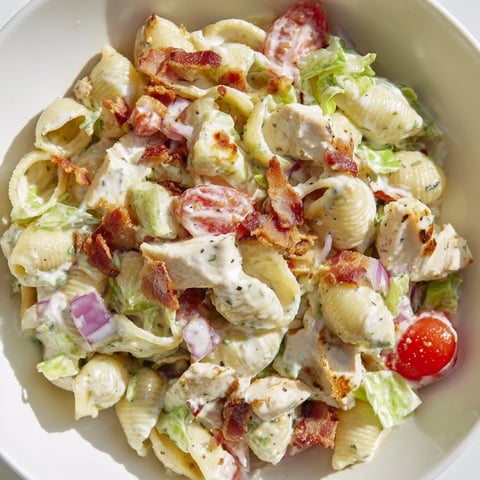 BLT Chicken Pasta Salad, bursting with fresh tomatoes, bacon, and grilled chicken, ready to eat.