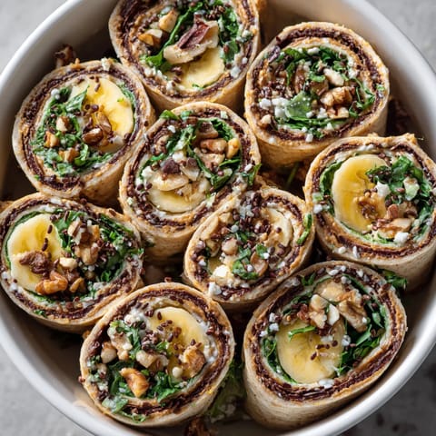 A bowl of food with a variety of ingredients.