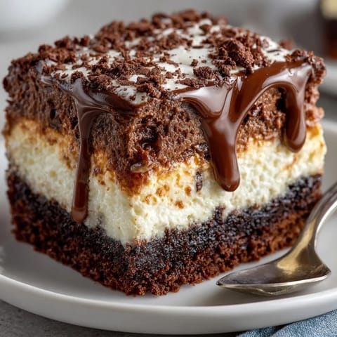 Warm Black Magic Gooey Cake, sliced to reveal a decadent, moist, chocolatey center.