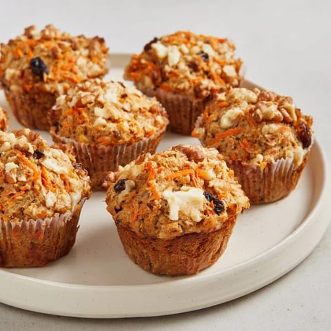 Delicious Protein Carrot Cake Ricotta Muffins cooling on a wire rack, perfect for snacks.  