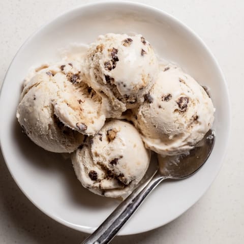 Guilt-free cottage cheese ice cream mixed with sweet cookie dough for a tasty treat.  