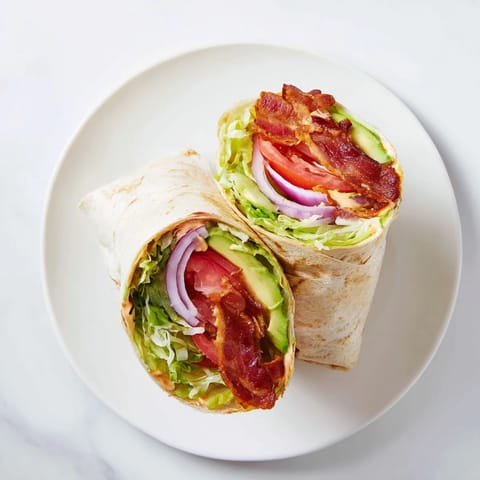 Crispy bacon and fresh veggies fill the soft tortilla in these Zesty BLT Wraps with flavor.
