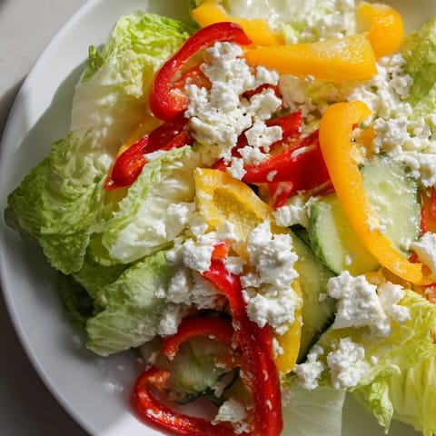 Close-up of a refreshing Bella Hadid Salad, showcasing vibrant peppers and a zesty lemon dressing.