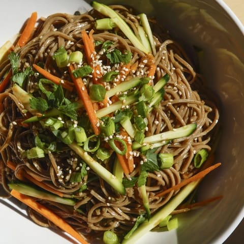 Make-ahead Chilled Noodle Lunch Cups present a vibrant, vegetarian meal with cold noodles and sesame seeds.