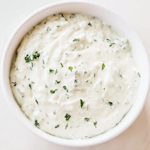 Close-up of fresh, flavorful Green Goddess Salad Dip, showcasing bright herbs and tangy taste.